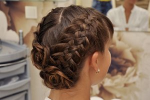 Brunette bride with a braided French plait updo